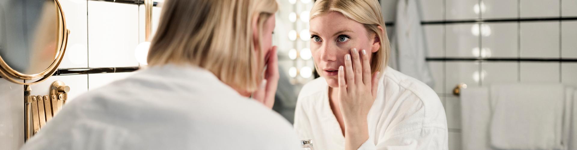 Woman removing contact lenses